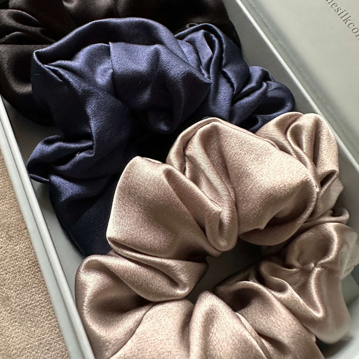 silk scrunchies in silver, dark blue and black