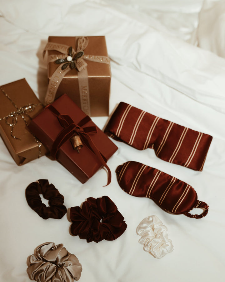 Christmas flat lay stripe silk eye masks scrunchies wrapped gifts