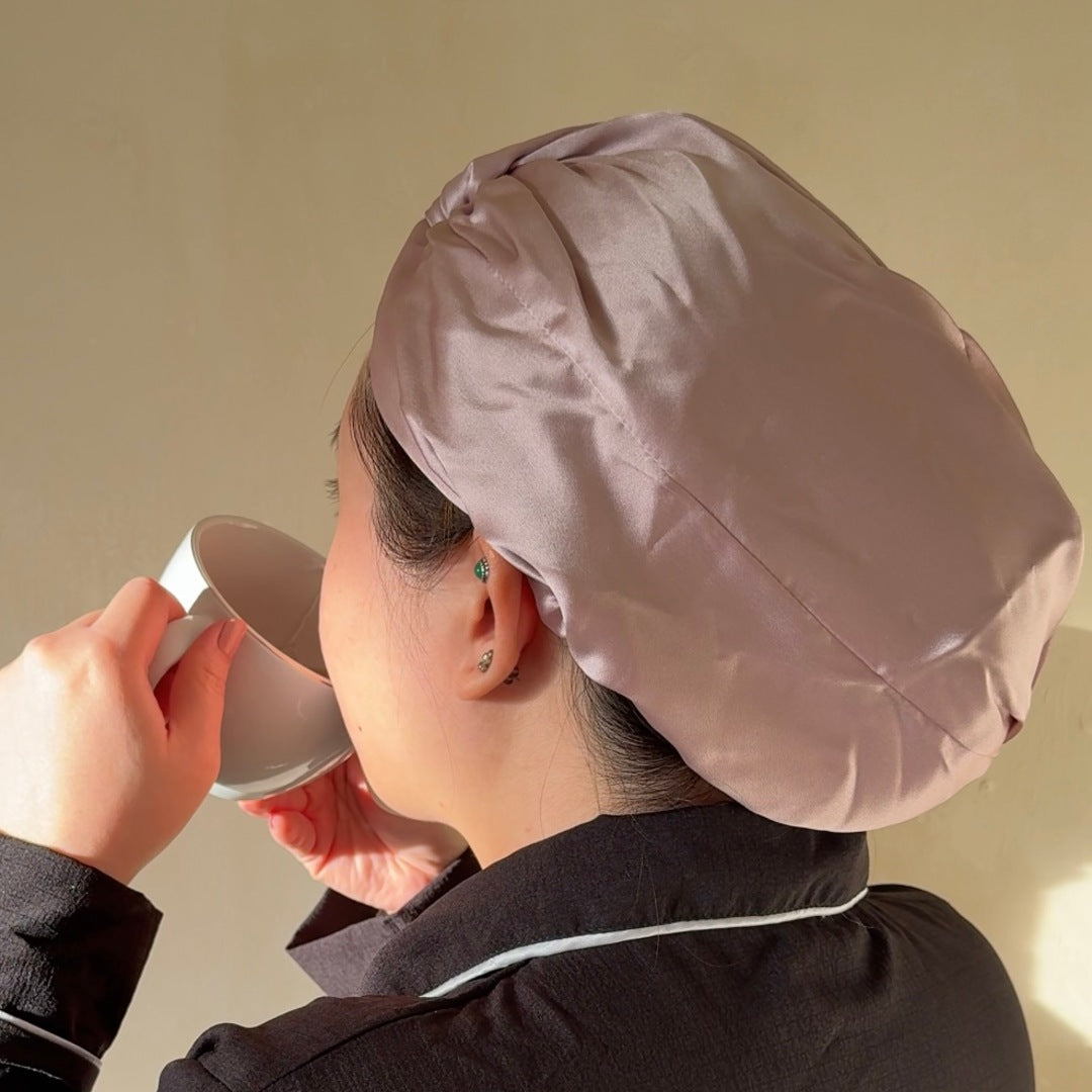 Wearing the silk hair bonnet in the evening, hair wrapped and protected overnight