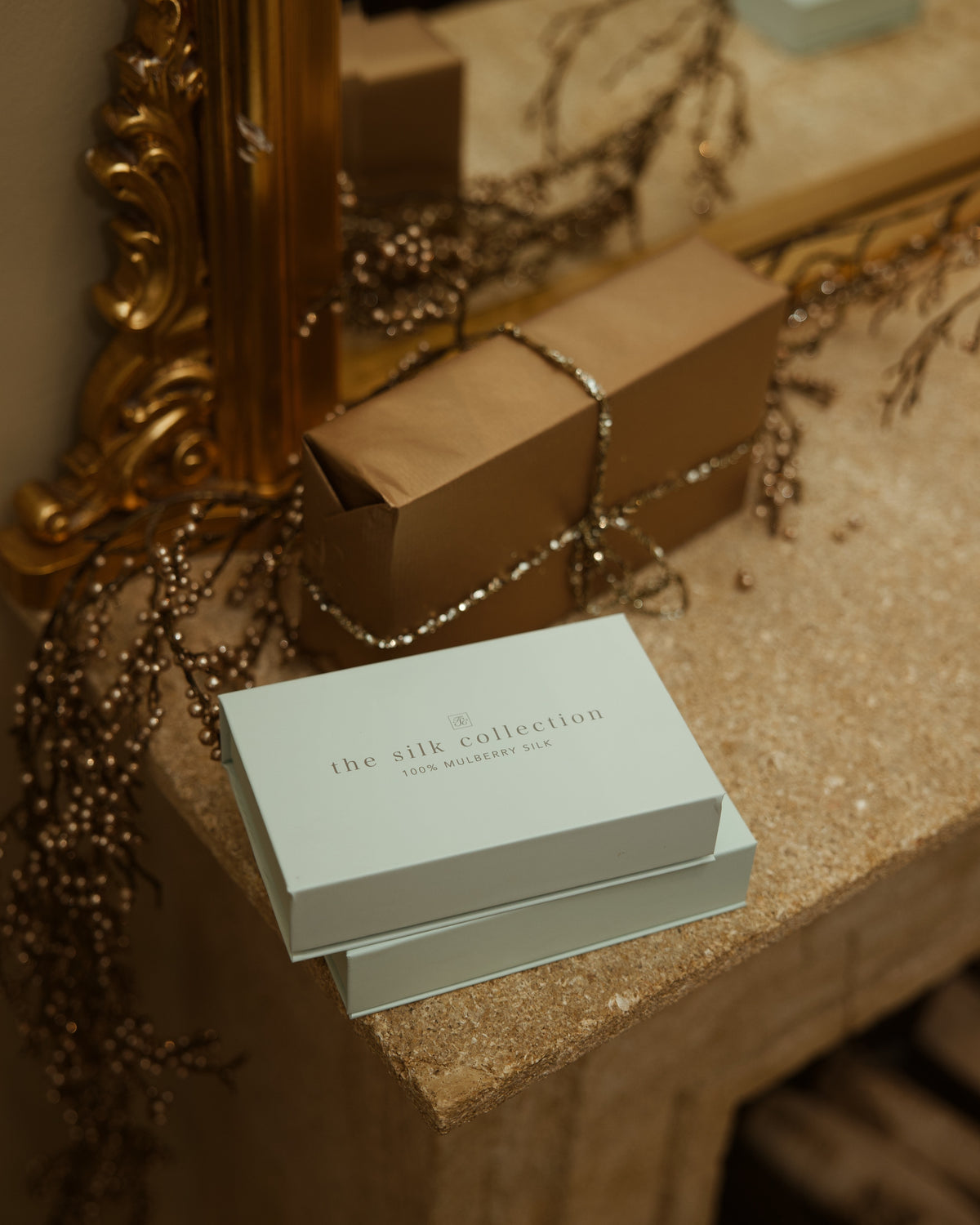 The Silk Collection gift boxes wrapped gift dresser gilt mirror still life